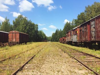 Train on railroad track against sky