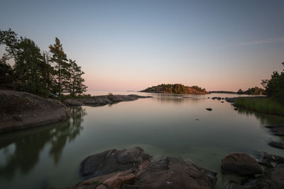 Scenic view of lake against sky during sunset