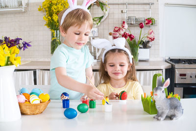 Portrait of cute girl playing with toys at home