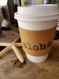 Close-up of coffee cup on table