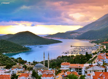 High angle view of townscape by sea against sky