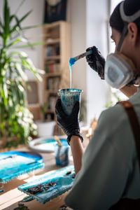 Dentist examining patient in laboratory