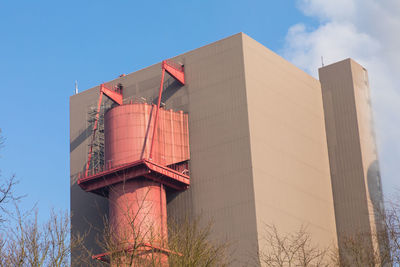 Low angle view of building against blue sky