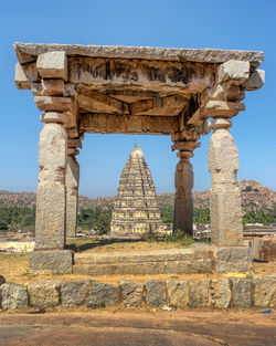 Low angle view of old ruins against clear blue sky