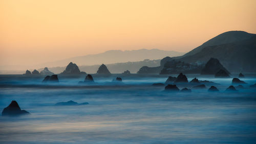 Scenic view of sea against sky during sunset