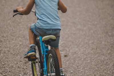 Man riding bicycle on road