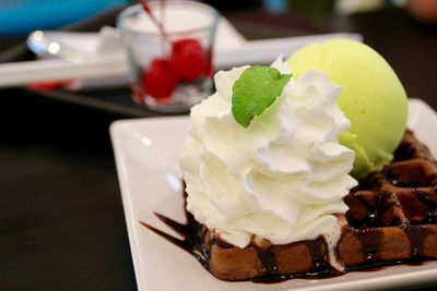 Close-up of served ice cream in plate on table