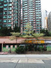 Street by buildings in city