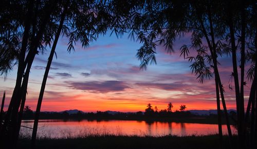 Scenic view of lake against sky during sunset