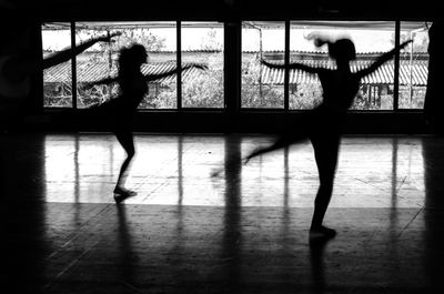 Silhouette of dancers in studio