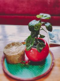 Close-up of strawberries in glass jar on table