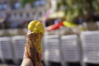 Midsection of person holding ice cream