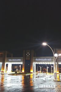Illuminated road sign at night
