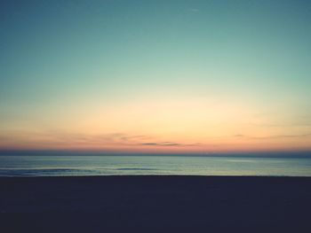 View of beach at sunset