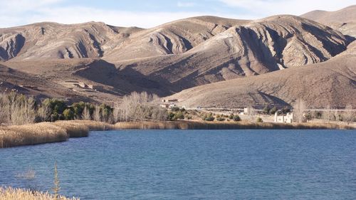 Scenic view of lake in front of mountains