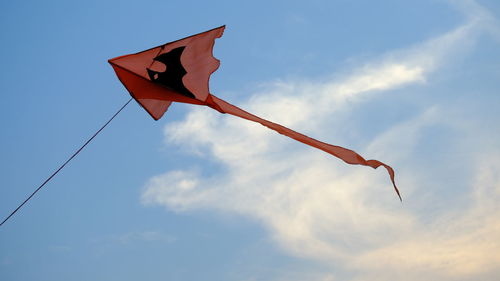 Low angle view of flag against sky