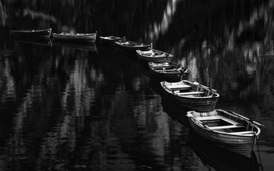 Boats moored in lake