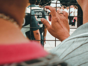 Rear view of people holding hands