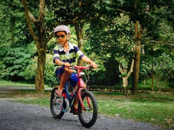 Portrait of happy girl riding bicycle