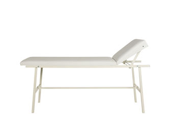 Close-up of empty chair on table against white background