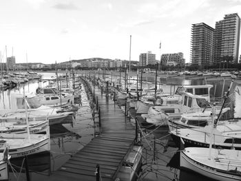 Boats moored at harbor