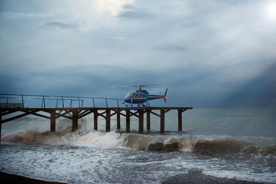 A helicopter lands people, during a gale. marine gale. patrol helicopter