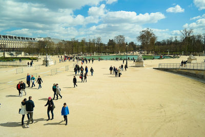 People on street against sky