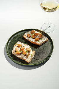 High angle view of food in plate on white background