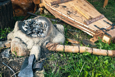 High angle view of old damaged tree on field