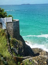 High angle view of sea shore against sky