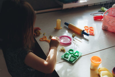 Child playing play dough. ild development concept, fine motor skills development.