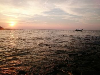 Scenic view of sea against sky during sunset