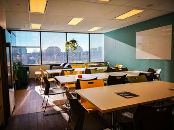 Chairs and tables in illuminated room