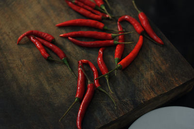 Close-up of red chili peppers on table