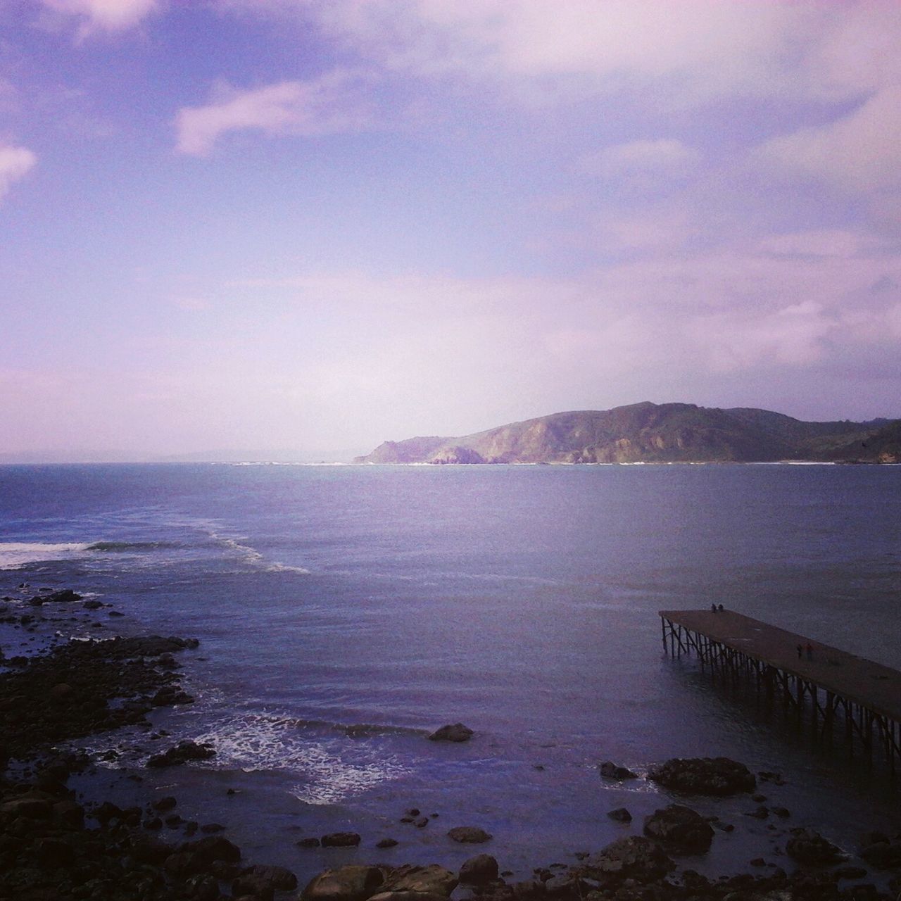 sea, water, scenics, tranquil scene, sky, beauty in nature, tranquility, horizon over water, nature, beach, cloud - sky, idyllic, shore, mountain, pier, cloud, cloudy, rock - object, remote, calm