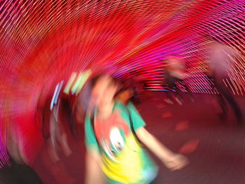 Blurred motion of illuminated carousel at amusement park