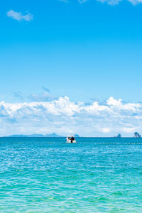 Scenic view of sea against cloudy sky