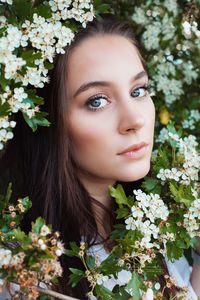 Portrait of woman with pink flowers