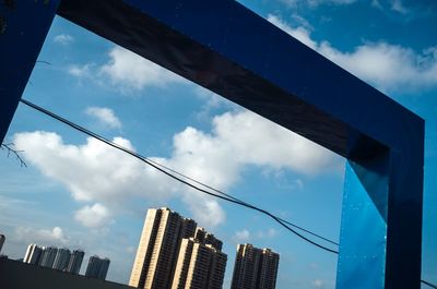 Low angle view of modern buildings against sky