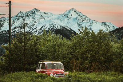 Car on mountain against sky during winter