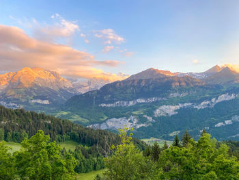 Scenic view of landscape and mountains against sky