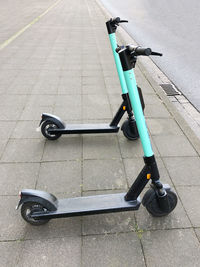 High angle view of bicycle on sidewalk