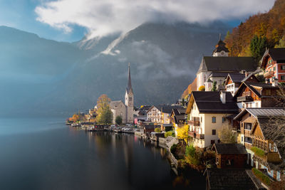 Panoramic view of buildings and mountains against sky