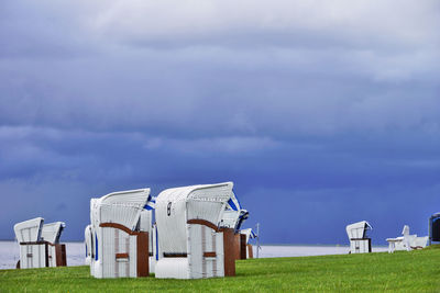 Built structure on field against sky