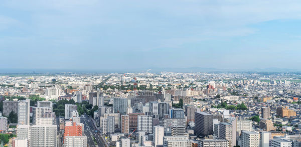 High angle view of buildings against sky in city