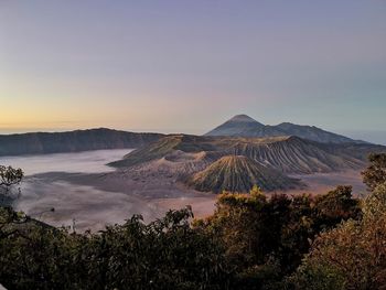 Scenic view of landscape against sky during sunset