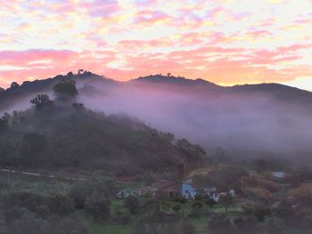 Scenic view of mountains at sunset