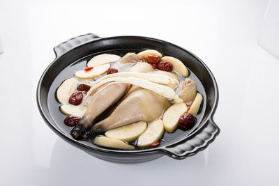 High angle view of food in bowl against white background