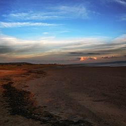 Scenic view of beach against sky