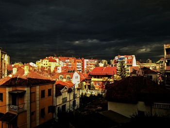 Low angle view of town against sky at night